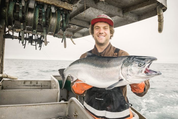 Man holding giant salmon