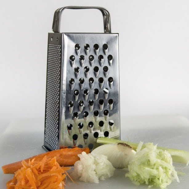 Grater with fresh vegetables